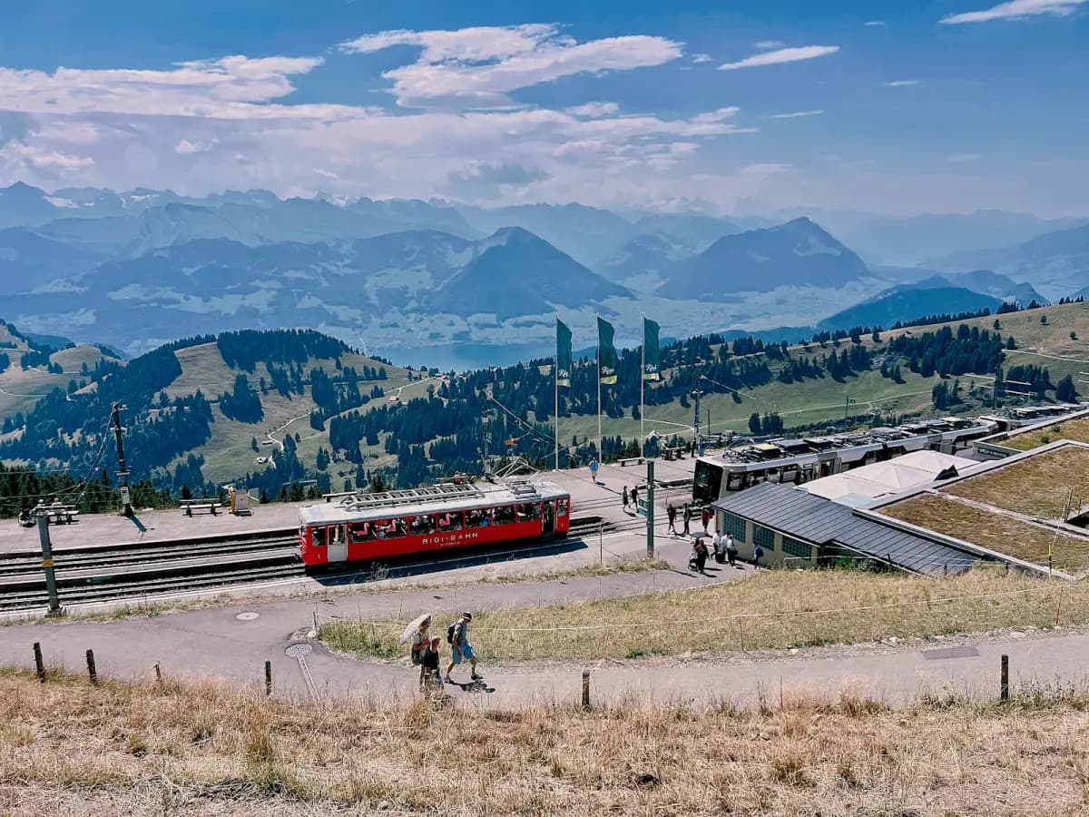 Red mountain railway crossing an alpine landscape in the Swiss Alps