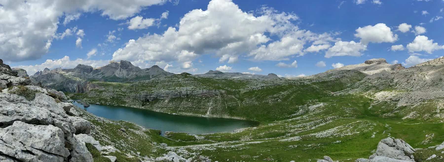 Alpine lake and mountain panorama in the Dolomites, Italy